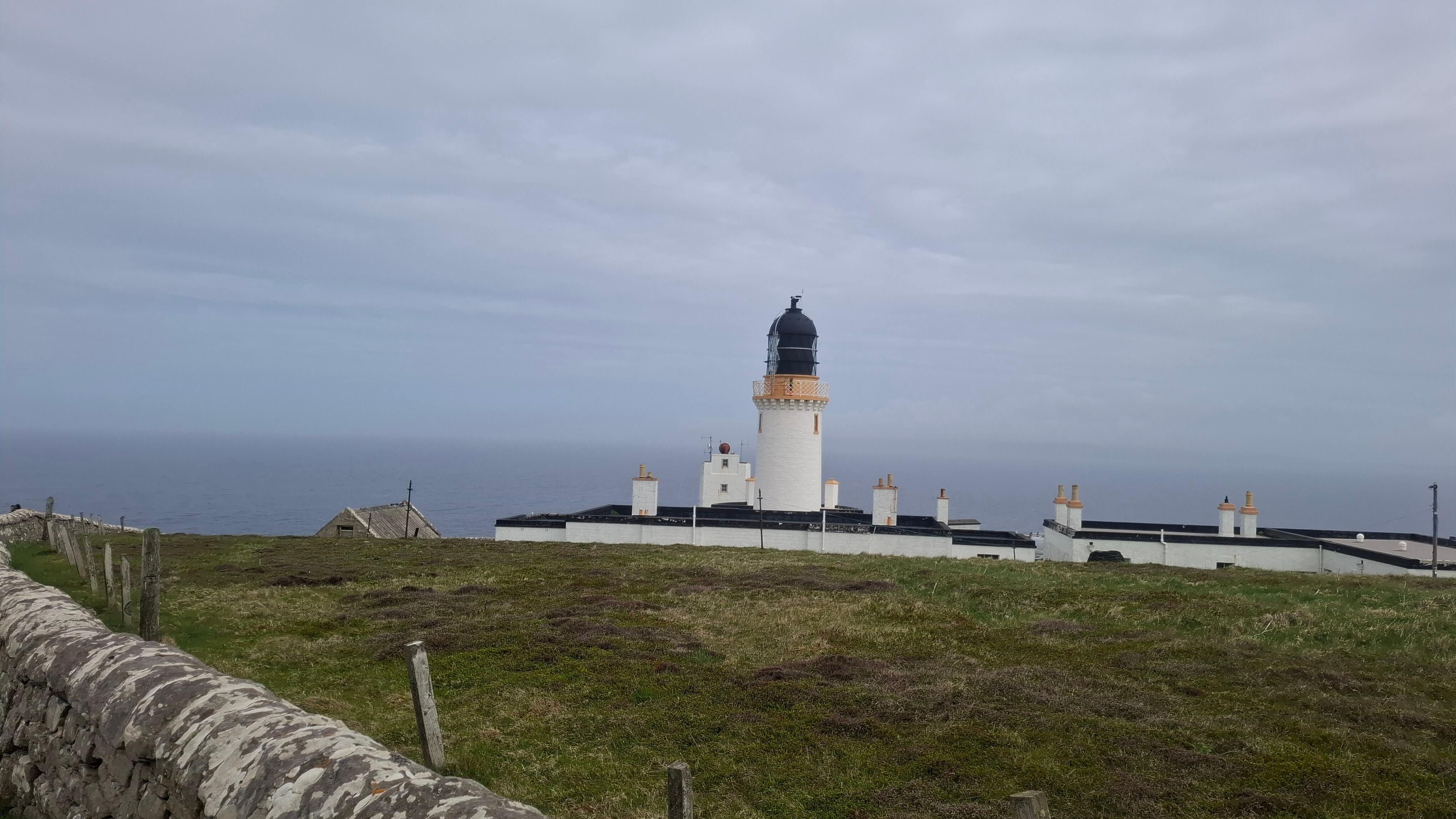 The lighthouse emerging from the fog