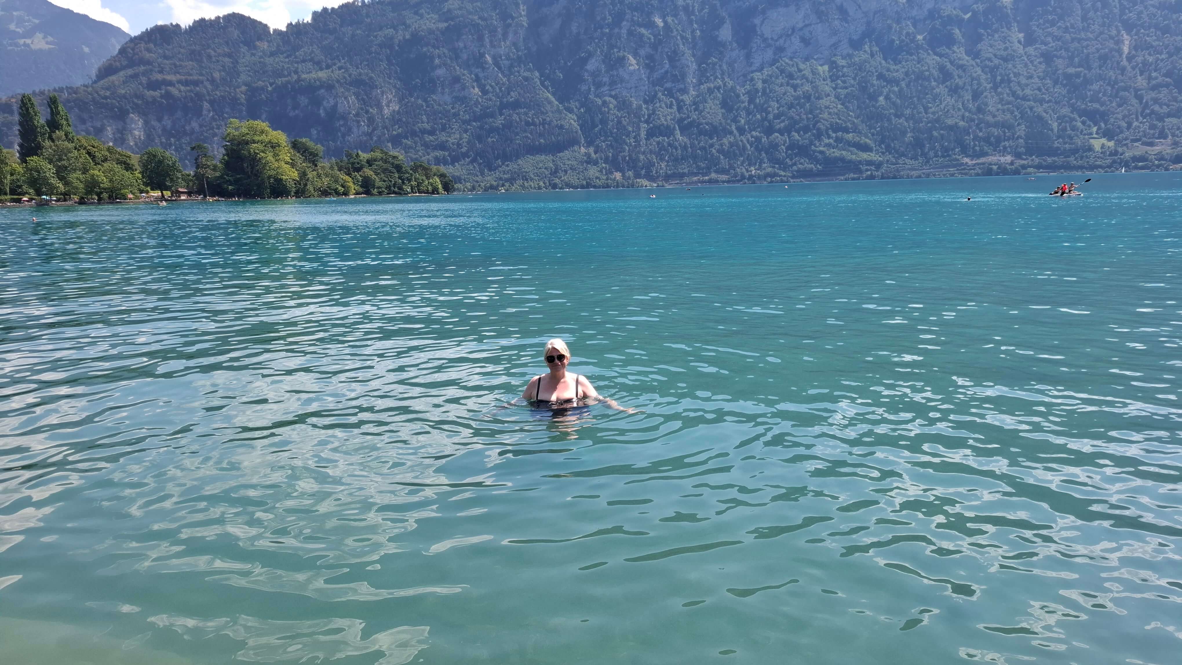 Relaxing by Lake Thun shore