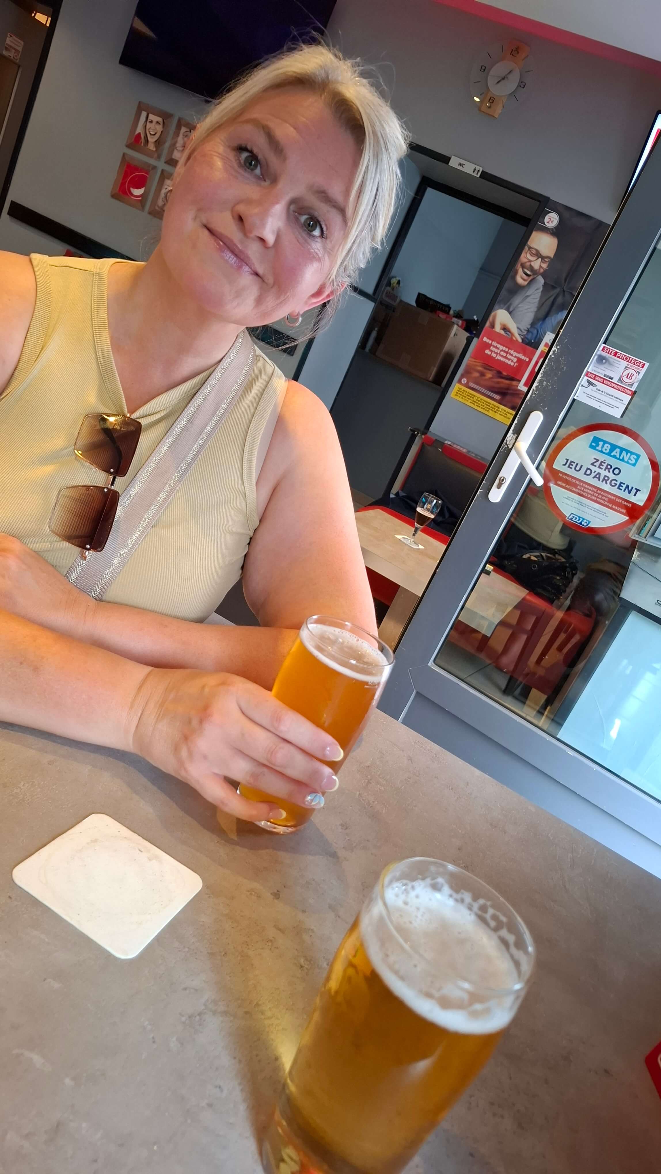 Mel with a beer at the second bar