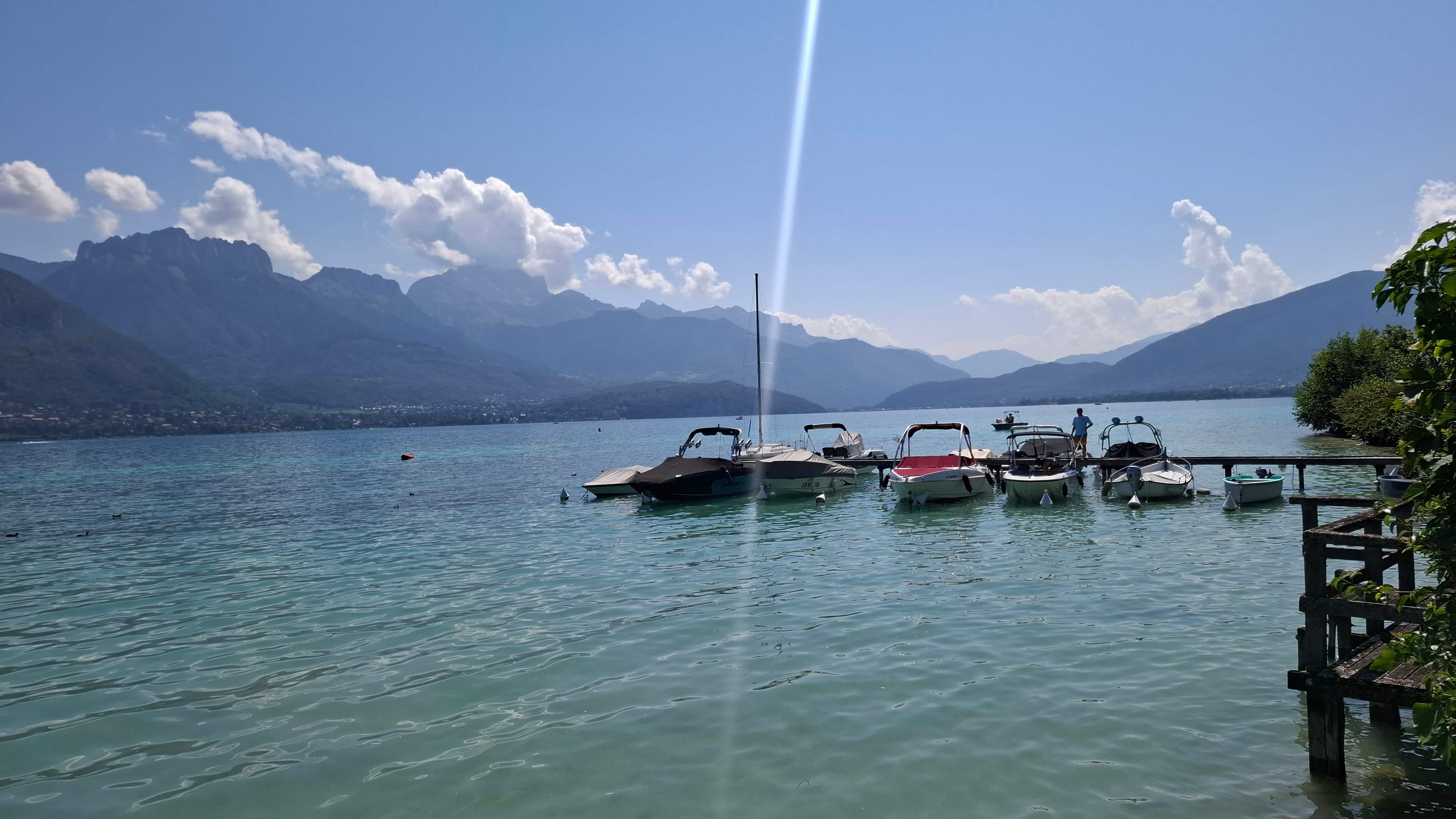 Getting closer to Annecy, boats moored along the shore