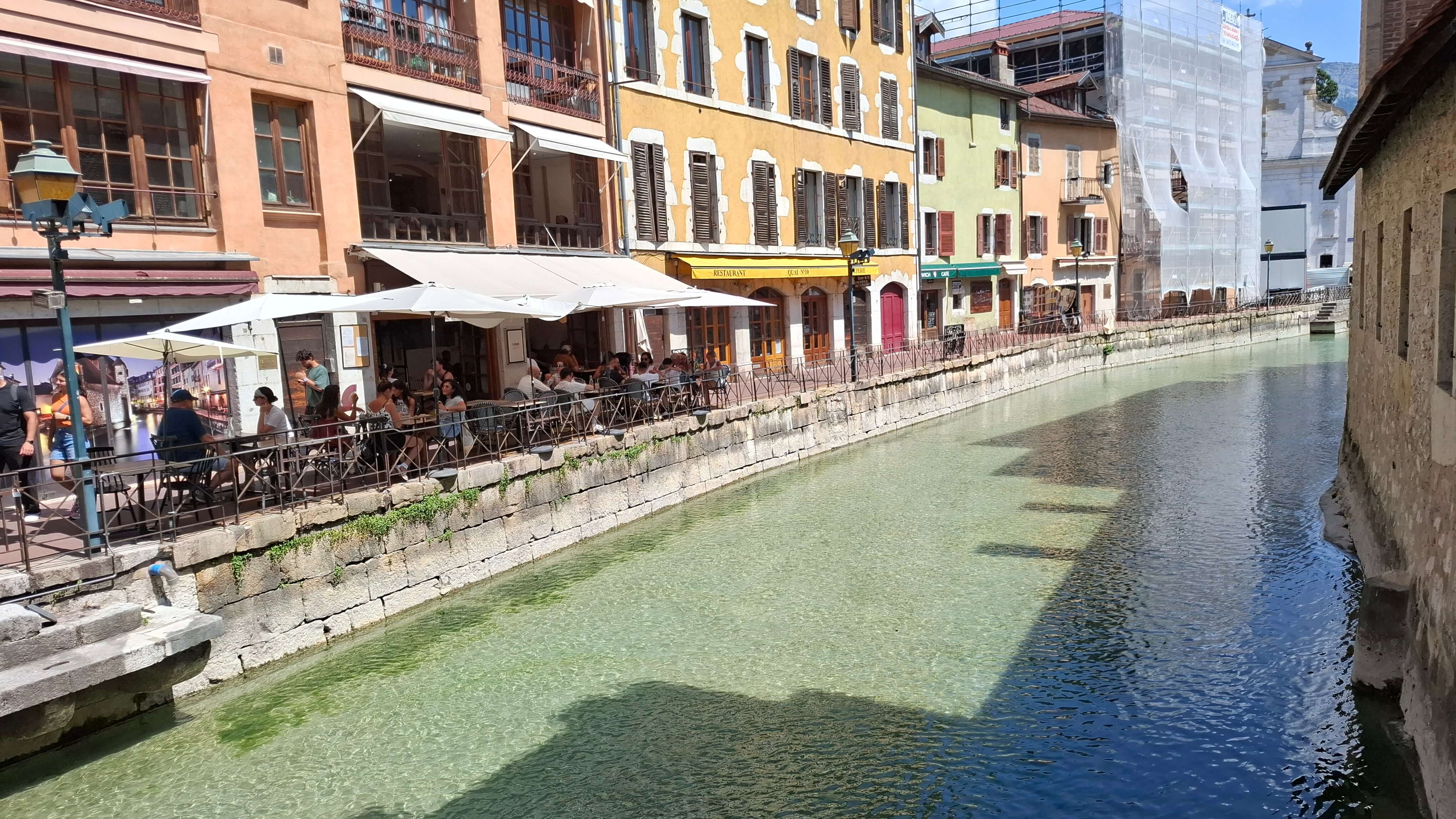 Pastel townhouses lining the water
