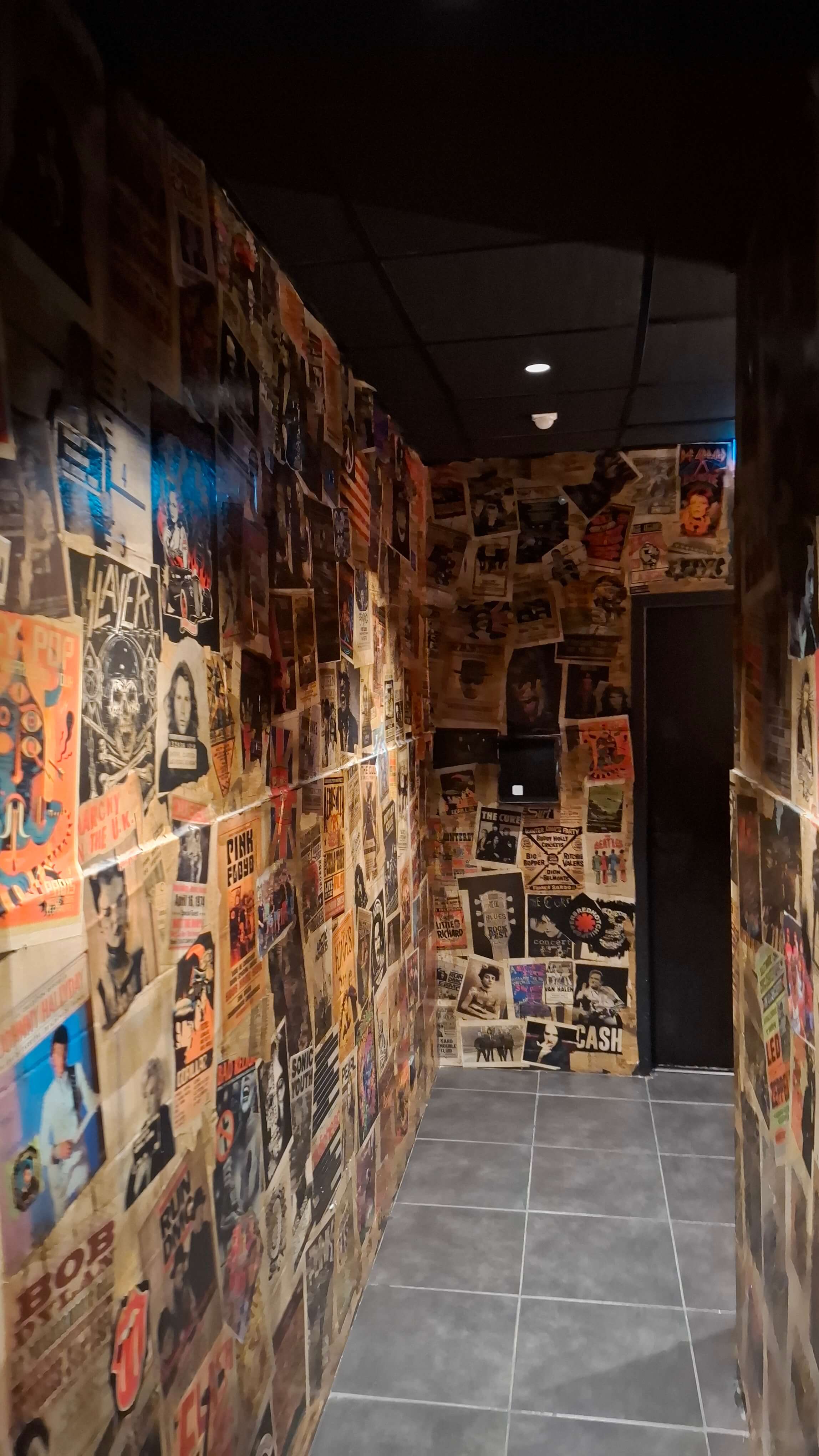 The poster-covered corridor at Saint Rock