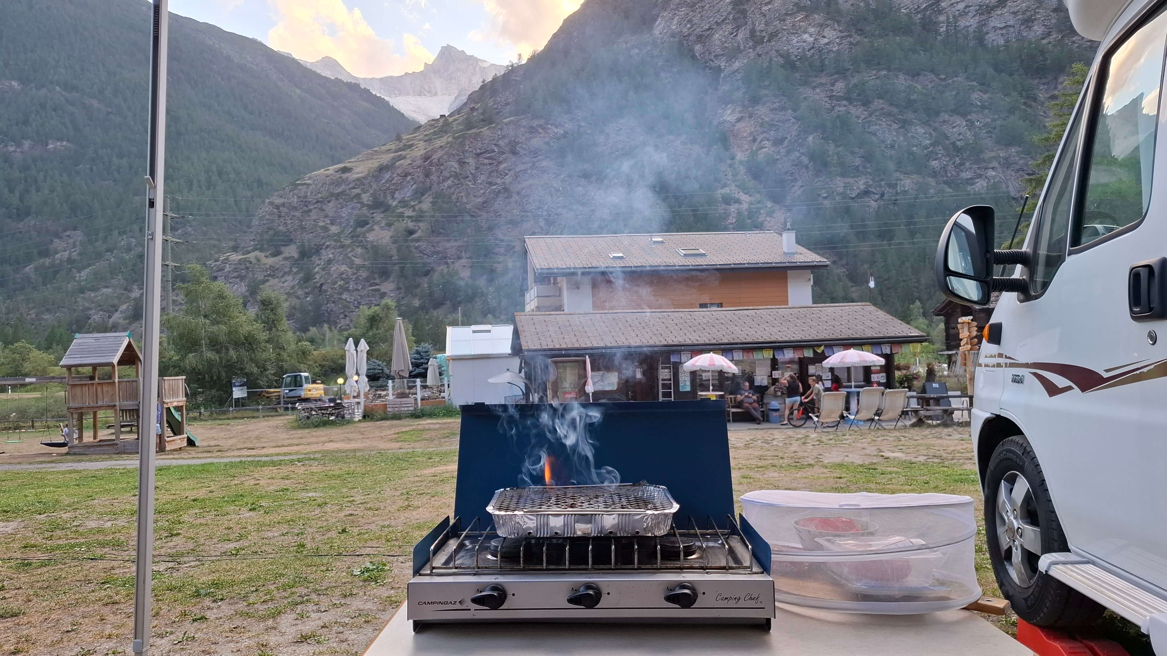 Evening barbecue setup at campsite